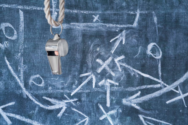 istock whistle of a soccer coach and strategy plan 899692116