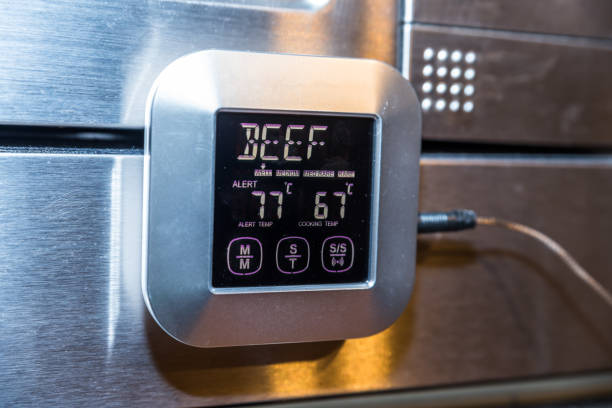 Beef roasting meat temperature conrol unit on silver oven Beef roasting meat temperature conrol unit on silver oven. temperatur stock pictures, royalty-free photos & images