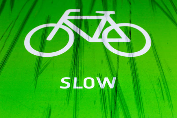 istock Bicycle lane with slow warning and skid marks 899692576