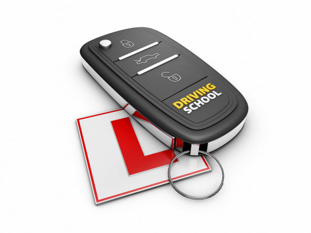istock 3d Illustration of car key on the white learner driver sign 899692690