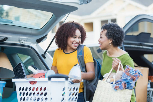 istock African-American mother helping daughter move 899704814