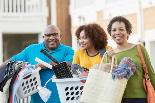 istock African-American parents helping daughter move 899705360