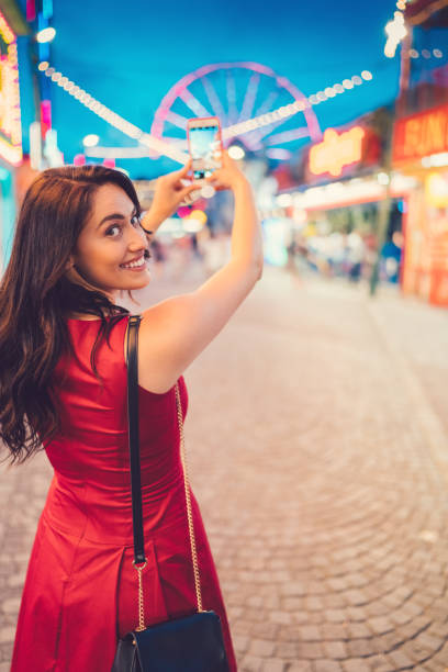 istock Girl at the amusement park 899707724