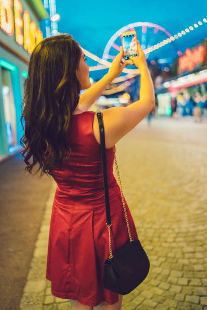 istock Girl at the amusement park 899707810