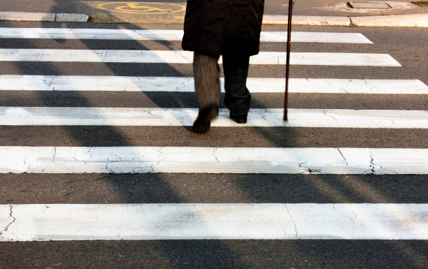 istock Senior person walking with a cane 899715422