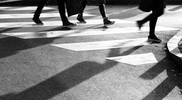 istock Blurry zebra crossing with silhouette and shadow 899715572