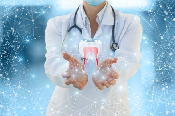 istock Doctor shows a tooth . 899731772