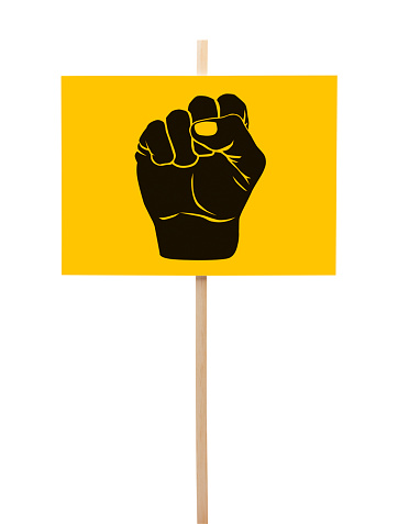 Yellow and Black Protestor Sign with Fist Isolated on White Background.