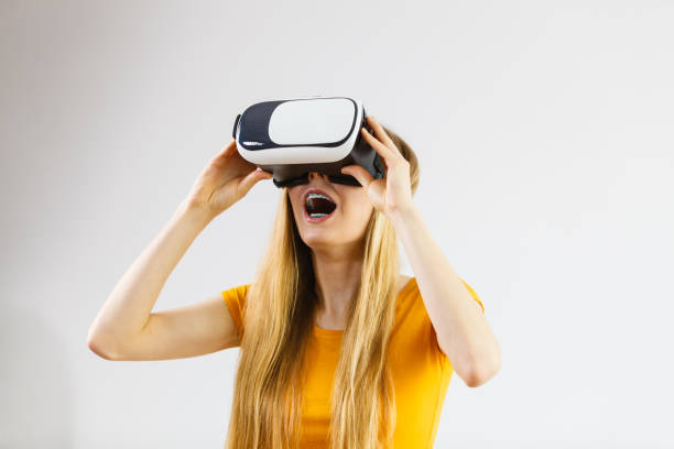 istock Girl wearing virtual reality goggles. 899732386