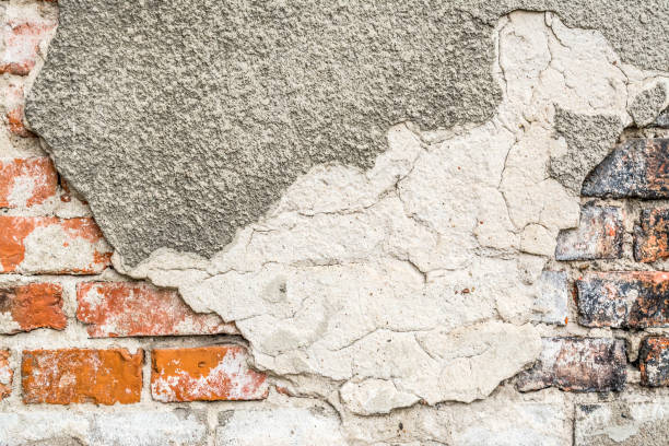 istock Brick old vintage grunge wall with cracks close-up texture background 899732670