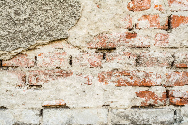 istock Brick old vintage grunge wall with cracks close-up texture background 899732716