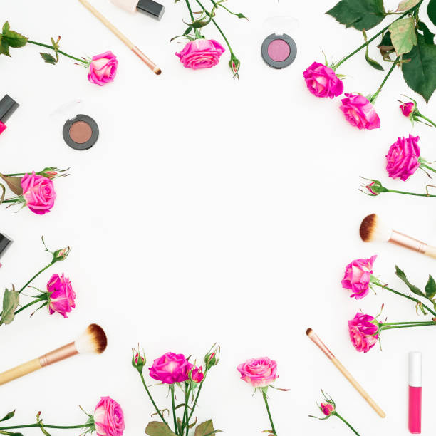 istock Floral frame with feminine composition with pink roses and cosmetics on white background. Beauty concept. Flat lay, Top view. 899736180