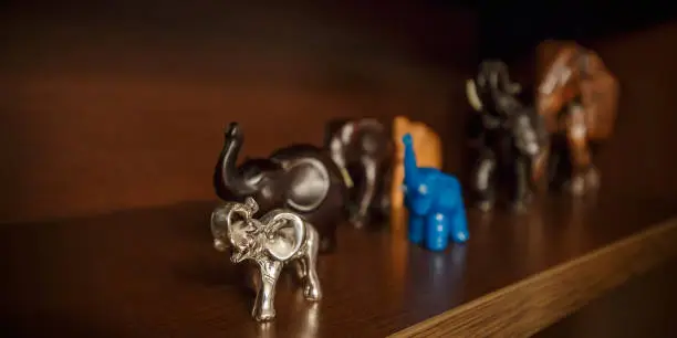 Souvenir elephant on hand as a symbol of a gift for a holiday and wish good luck.