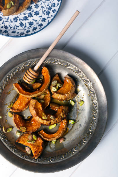 istock Baked pumpkin with pistachios and honey 899739280
