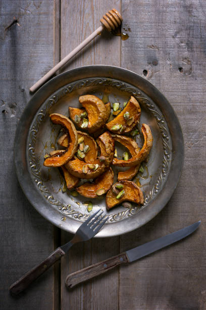 istock Baked pumpkin with pistachios and honey 899739666