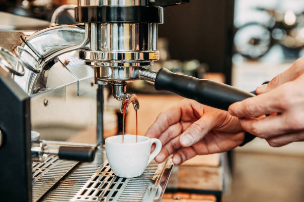 Coffee Making Barista making coffee at an espresso machine espresso maker stock pictures, royalty-free photos & images