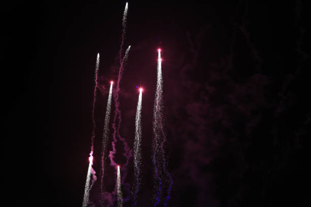 Pink fireworks flying at night sky, black sky stock photo