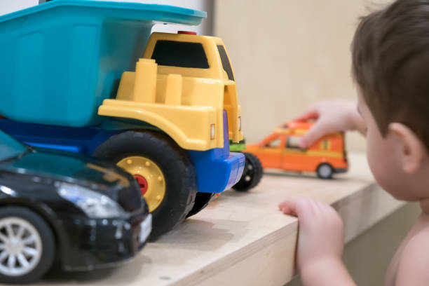 istock little boy plays with toy car at home 899748422