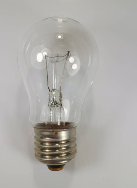 istock 40-watt incandescent lamp on white background 899751328