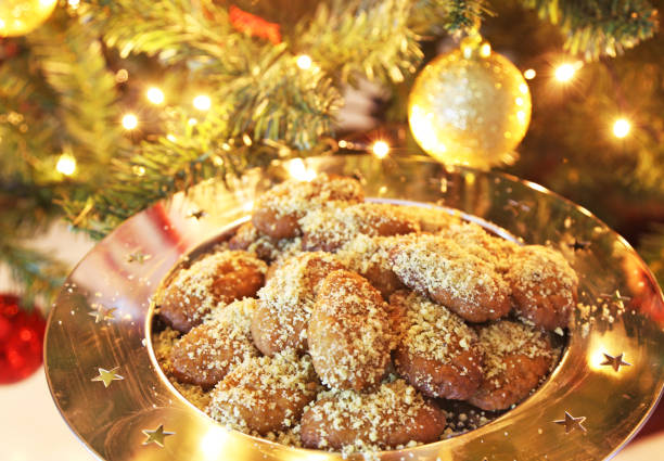 greek melomakarona traditional Christmas cookies with honey and nuts stock photo