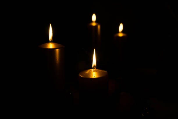 istock Candles burning in the dark. 899757712