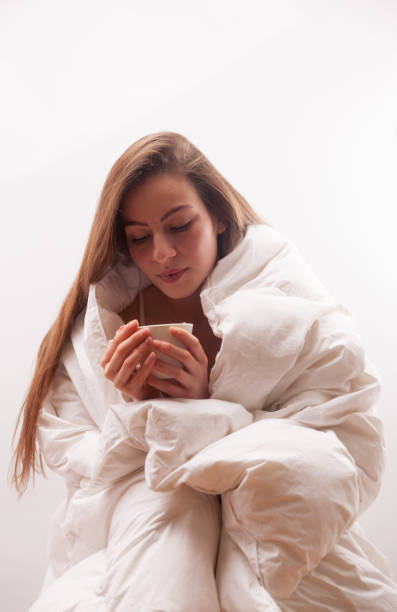 istock Pure young woman blowing coffee 899757940