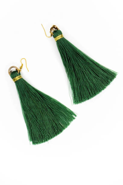 istock Green earrings on white background. 899758404
