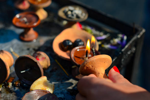 istock burning buddhist candles, ritual puja, India, Nepal 899758786