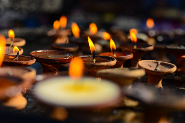 istock burning buddhist candles, ritual puja, India, Nepal 899758800