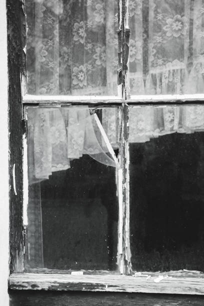istock old wooden window with curtains 899761138