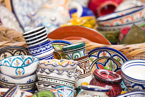 Plates, tajines and pots made of clay on the souk in Marocco.