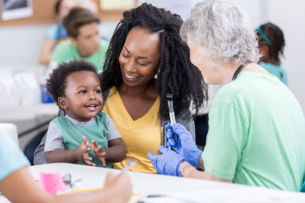 istock Baby boy claps and smiles during medical exam 899765040