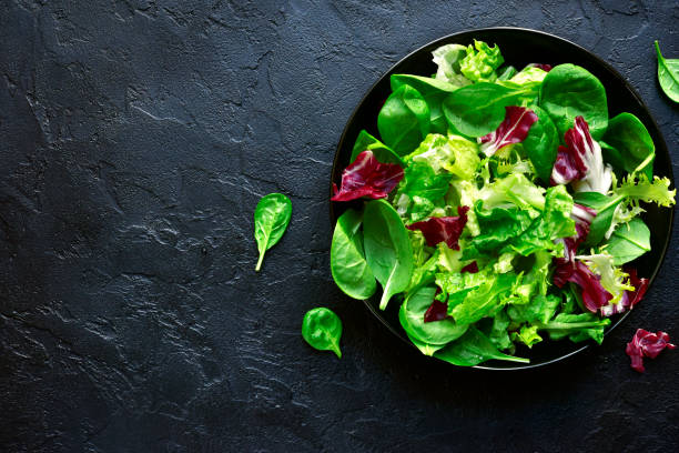 istock Mix salad leaves in a black bowl 899780194