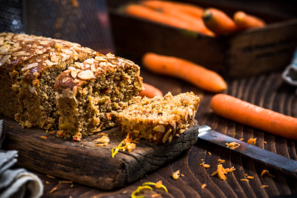 istock Homemade healthy carrot cake decorated with almonds and walnuts 899783270