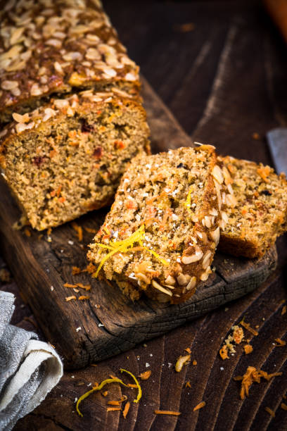 istock Carrot cake sliced on wooden rustic board 899783468