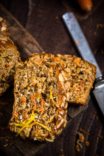 istock Carrot cake sliced on wooden rustic board 899783598