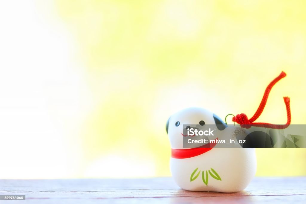 Japanese Dog Ornament A cute Japanese dog ornament for celebrating new year on green background. 2018 Stock Photo