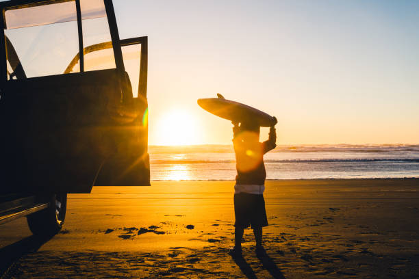 istock Kid with Buggy board on head walking towards beach. 899788958