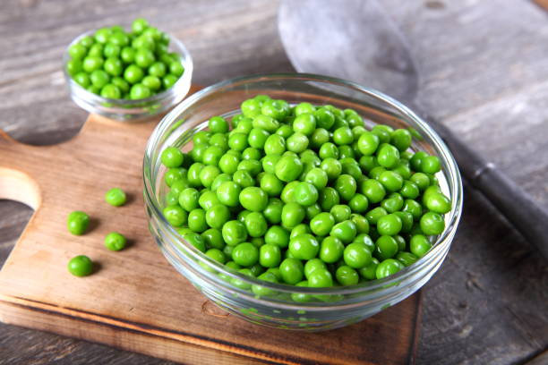 istock Fresh green peas in a bowl 899792144