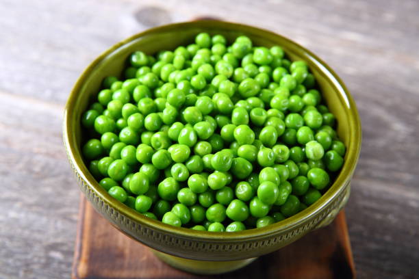 istock Fresh green peas in a bowl 899792270