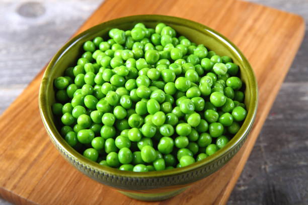 istock Fresh green peas in a bowl 899792688