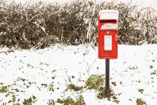 istock Red post box in a rural area covered in snow 899793000