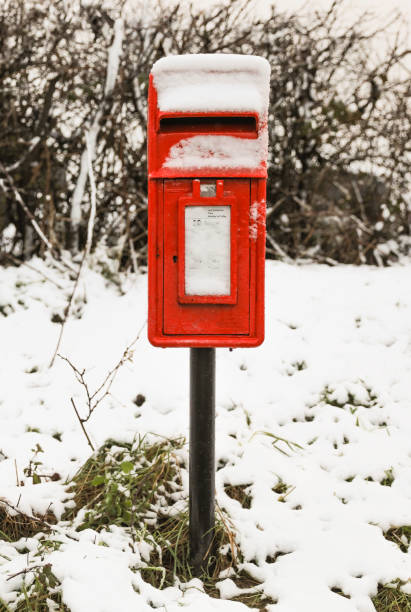 istock Red post box in a rural area covered in snow 899793044