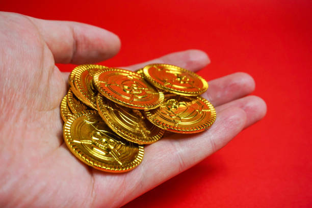 istock The gold coin which I rode on a hand 899797638