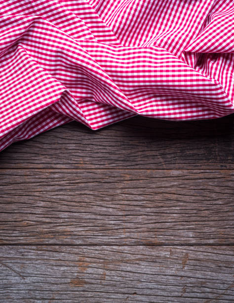 istock The checkered tablecloth on wooden table background 899815336
