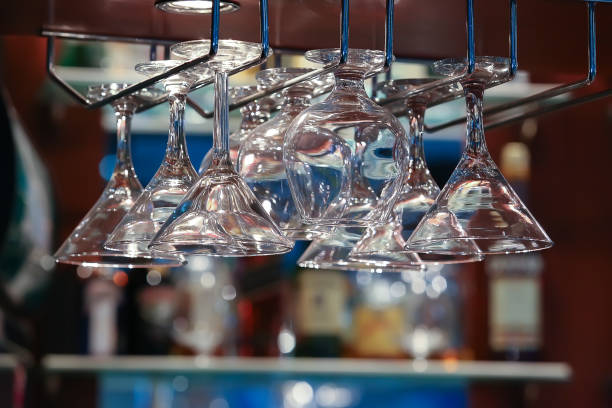istock glasses on an arm over bar counter 899819882