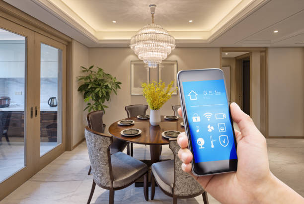 istock smart phone with smart home with modern dining room 899824856