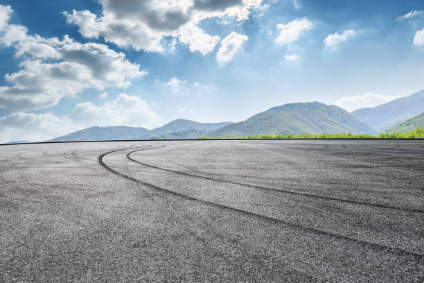 istock square road and mountain nature landscape in summer 899824870