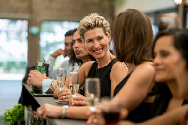 istock Group of business people having drinks at a bar 899827694