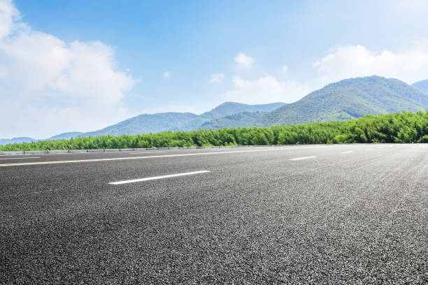 istock country road and mountains with forest in the summer 899827728